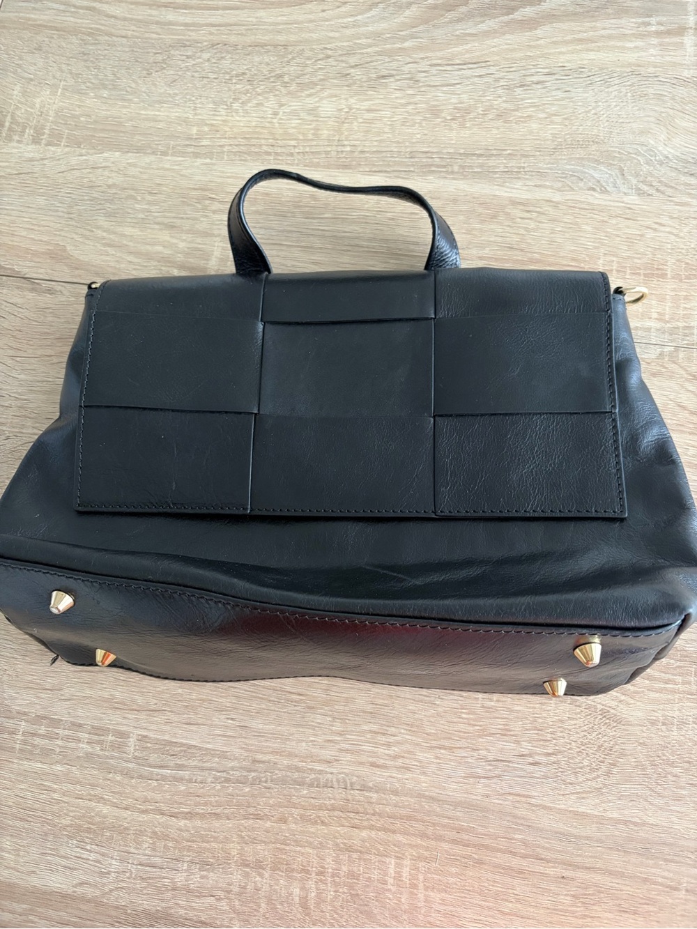 Structured Black Leather Top-Handle Satchel with Woven Flap Detail
